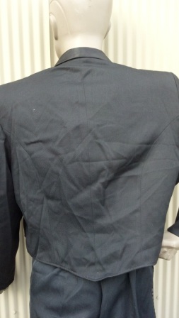 Short, cadet-style jacket, fully lined with single closure. Satin shawl