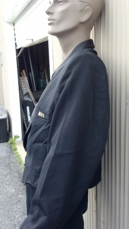 Short, cadet-style jacket, fully lined with single closure. Satin shawl