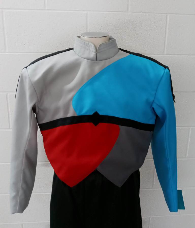 Carolina Blue, Red, Gray uniforms. Set includes: 96 jackets 97 pair gauntlets 150+ charcoal gray bib