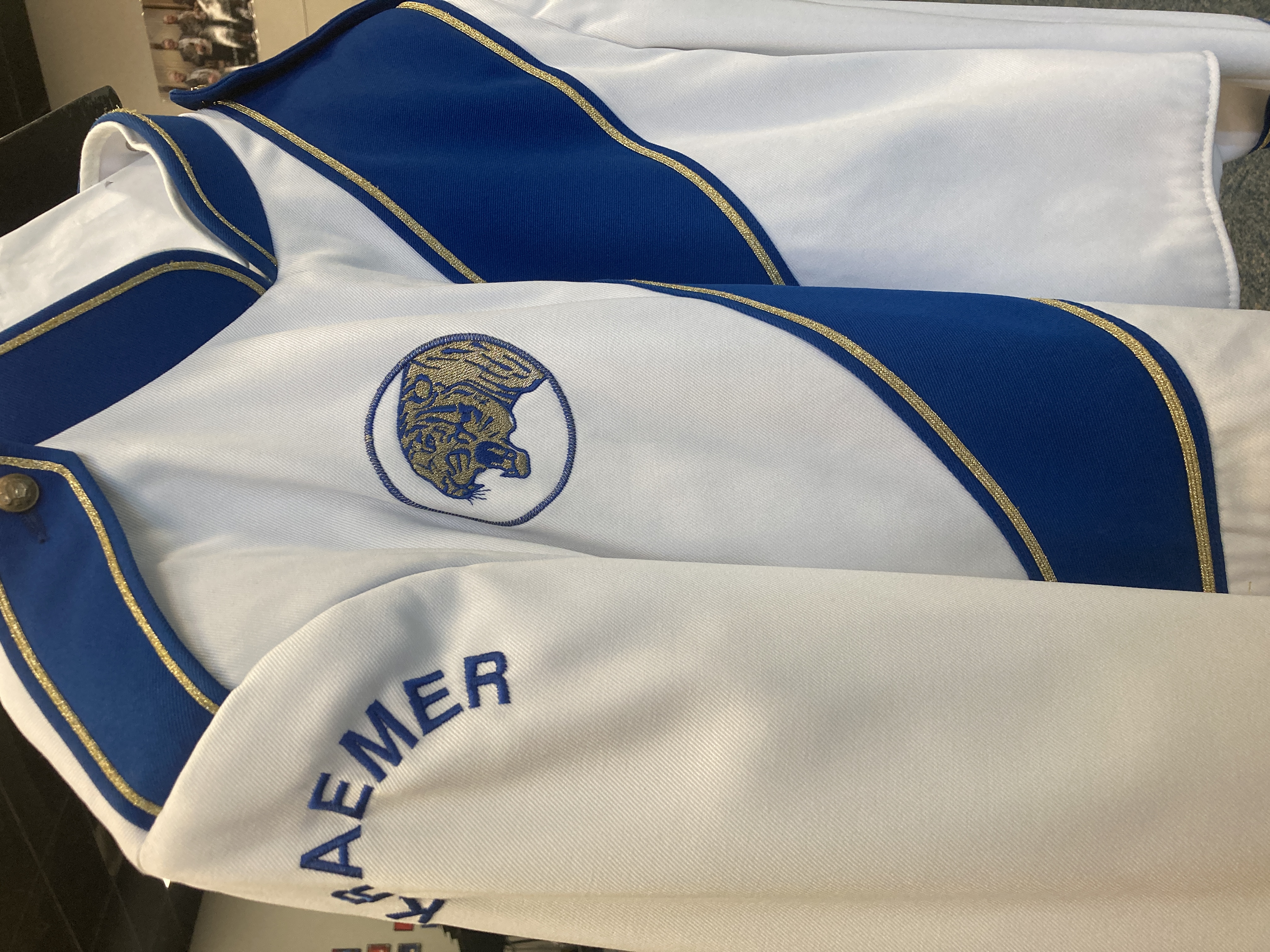 Set of 175 Blue and White Stanbury Marching Band Jackets and Black Fruhauf Bibs Item description: Ja