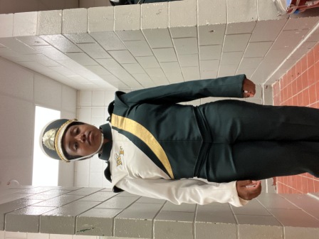 Set of 100 green, white, and gold Furhman marching band uniforms with matching shakos. Must be purch
