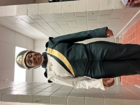 Set of 100 green, white, and gold Furhman marching band uniforms with matching shakos. Must be purch