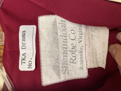 Lot of red choir robes and matching stoles