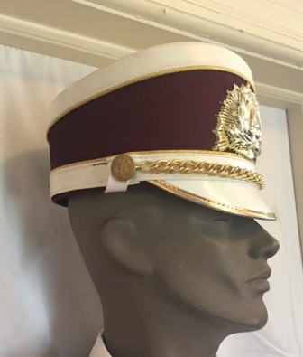 This is a set of 160+/- gently used burgundy and white Fruhauf shakos with gold hardware a