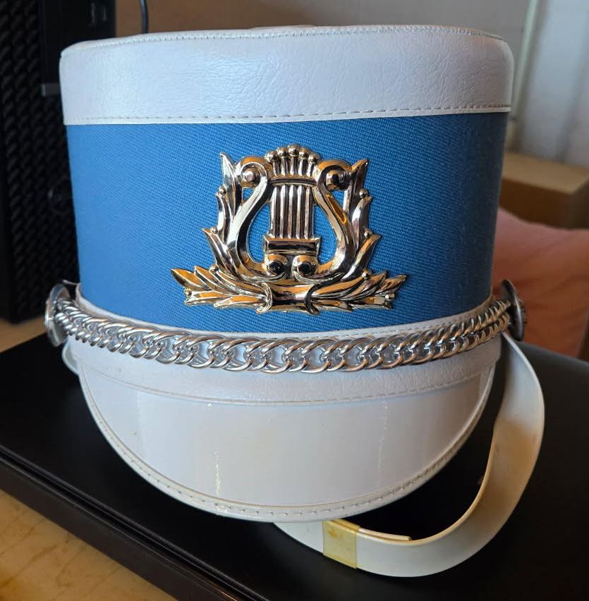 56 blue and white shako hats with gold lyre